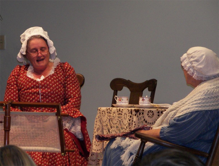 Mary Esther and friend on stage at symposium